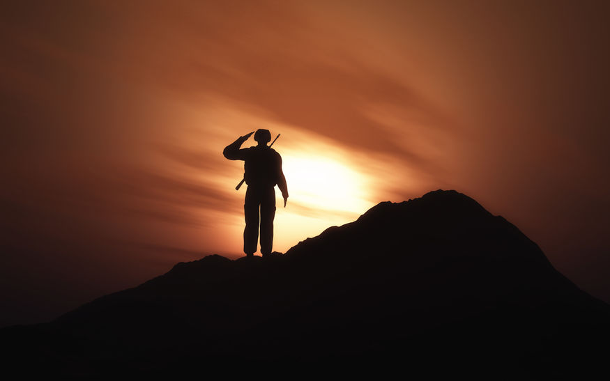 3D silhouette of a soldier saluting against a sunset sky